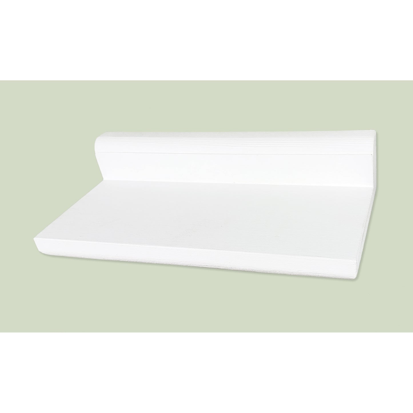 White floating shelf on a light green background