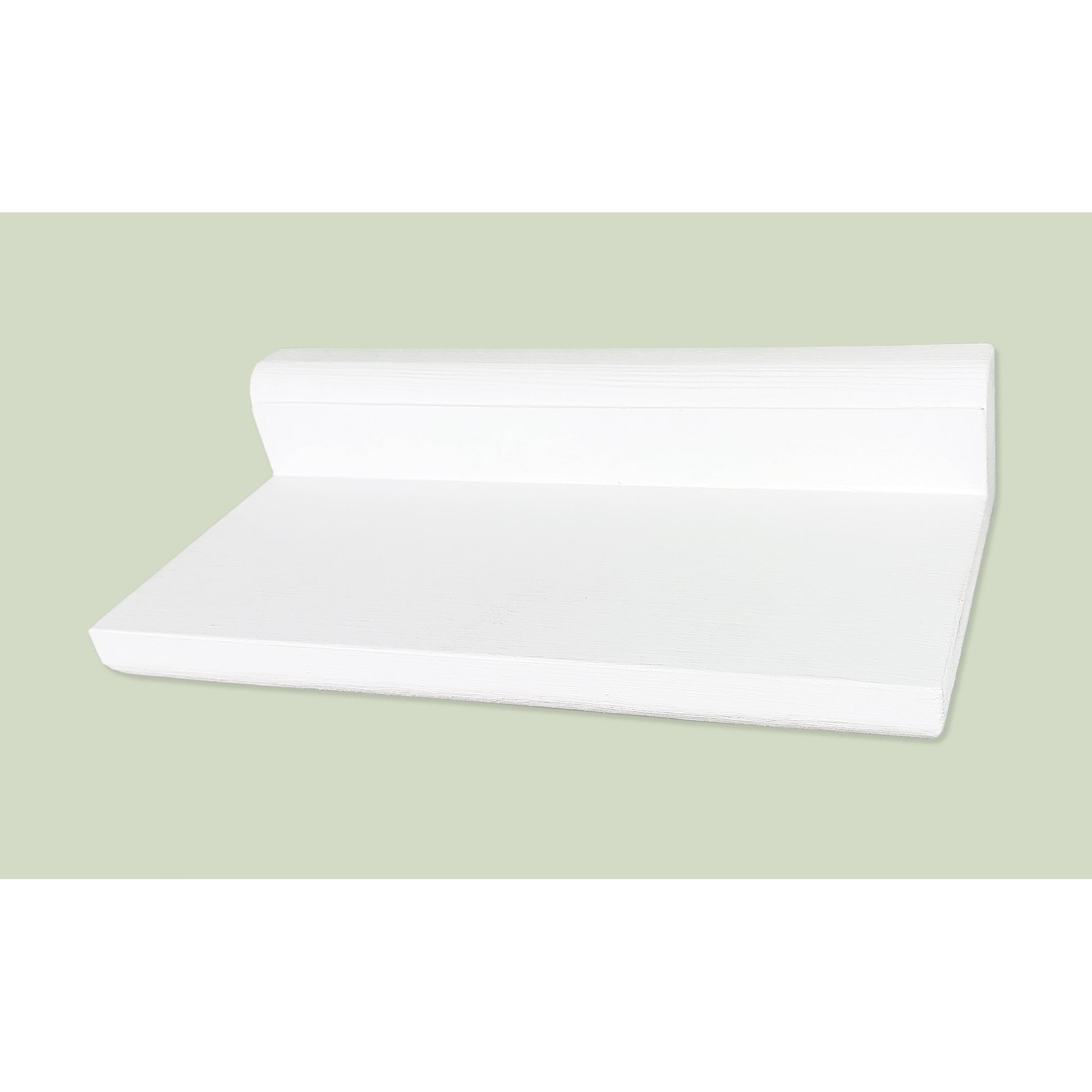 White floating shelf on a light green background