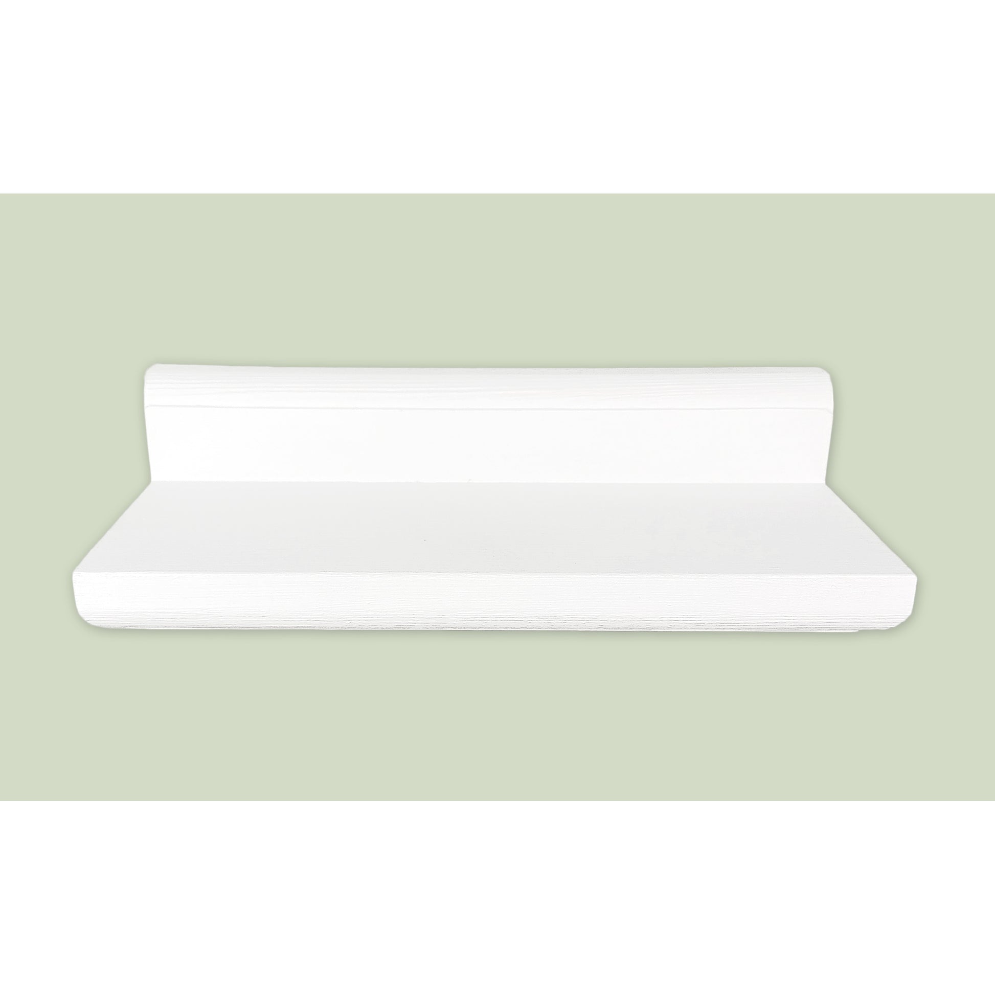 White floating shelf on a light green background