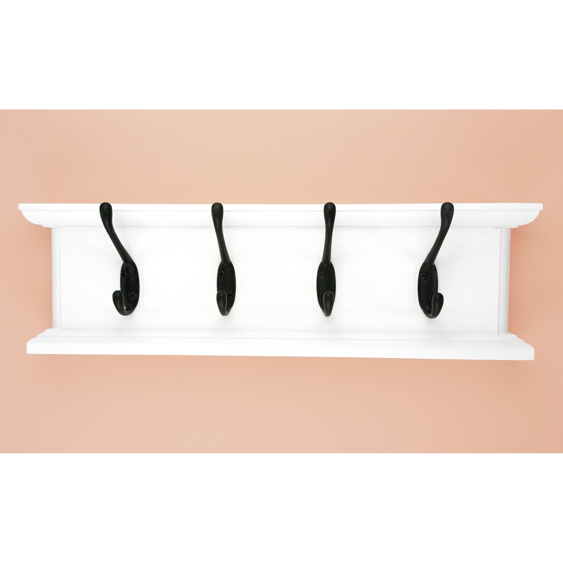 White wall-mounted coat rack with black hooks on a beige background