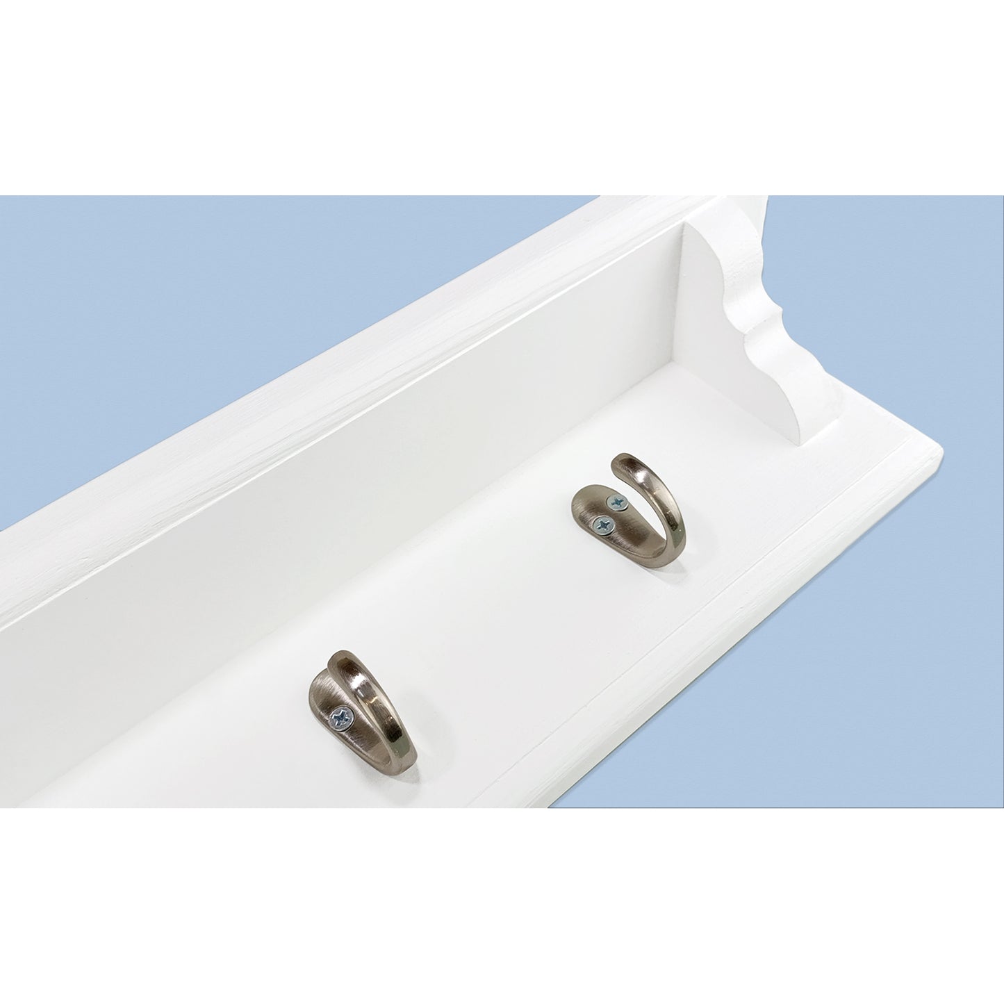 Two silver hooks on a white coat rack with a light blue background