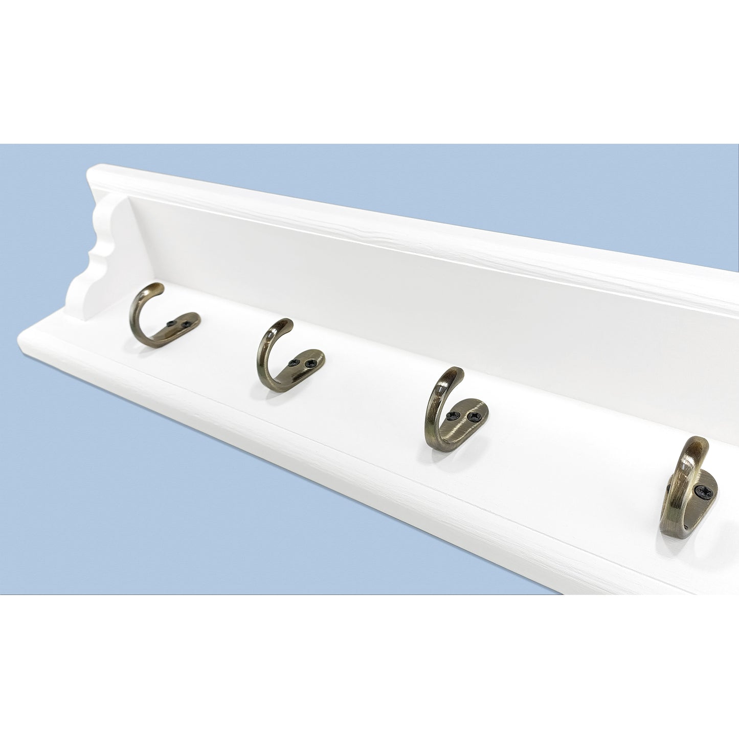 White wall-mounted hook rack with four hooks on a light blue background