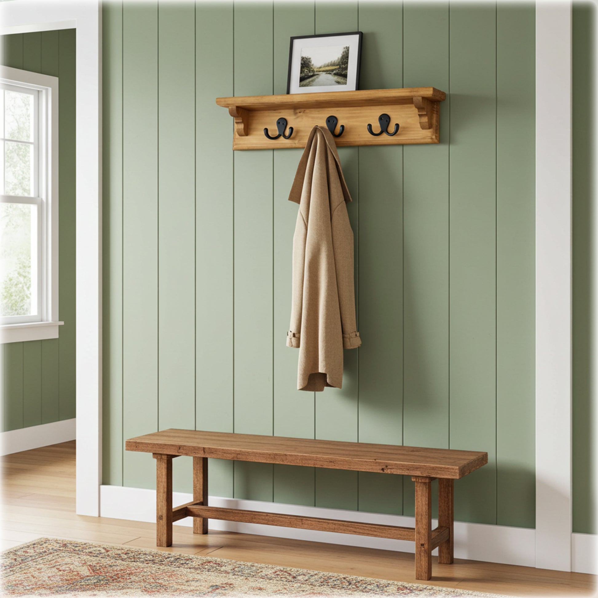 Wooden coat rack with hooks and a bench against a green paneled wall.