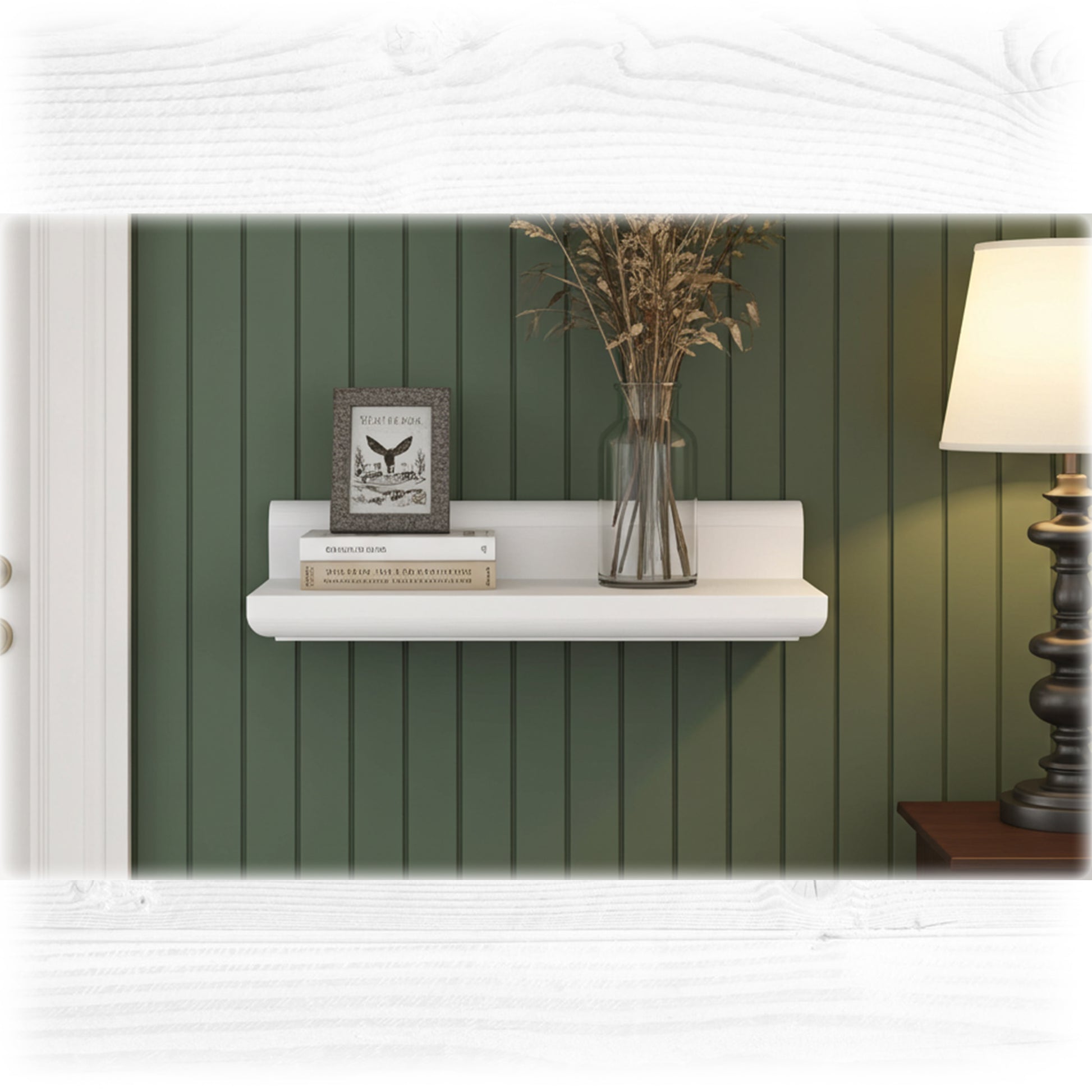 White shelf with decorative items against a green paneled wall