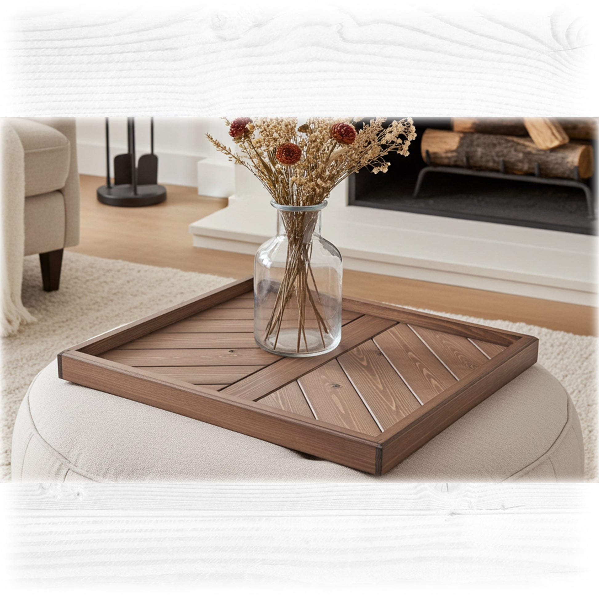 Wooden tray with a vase of flowers on a white ottoman in a living room setting.