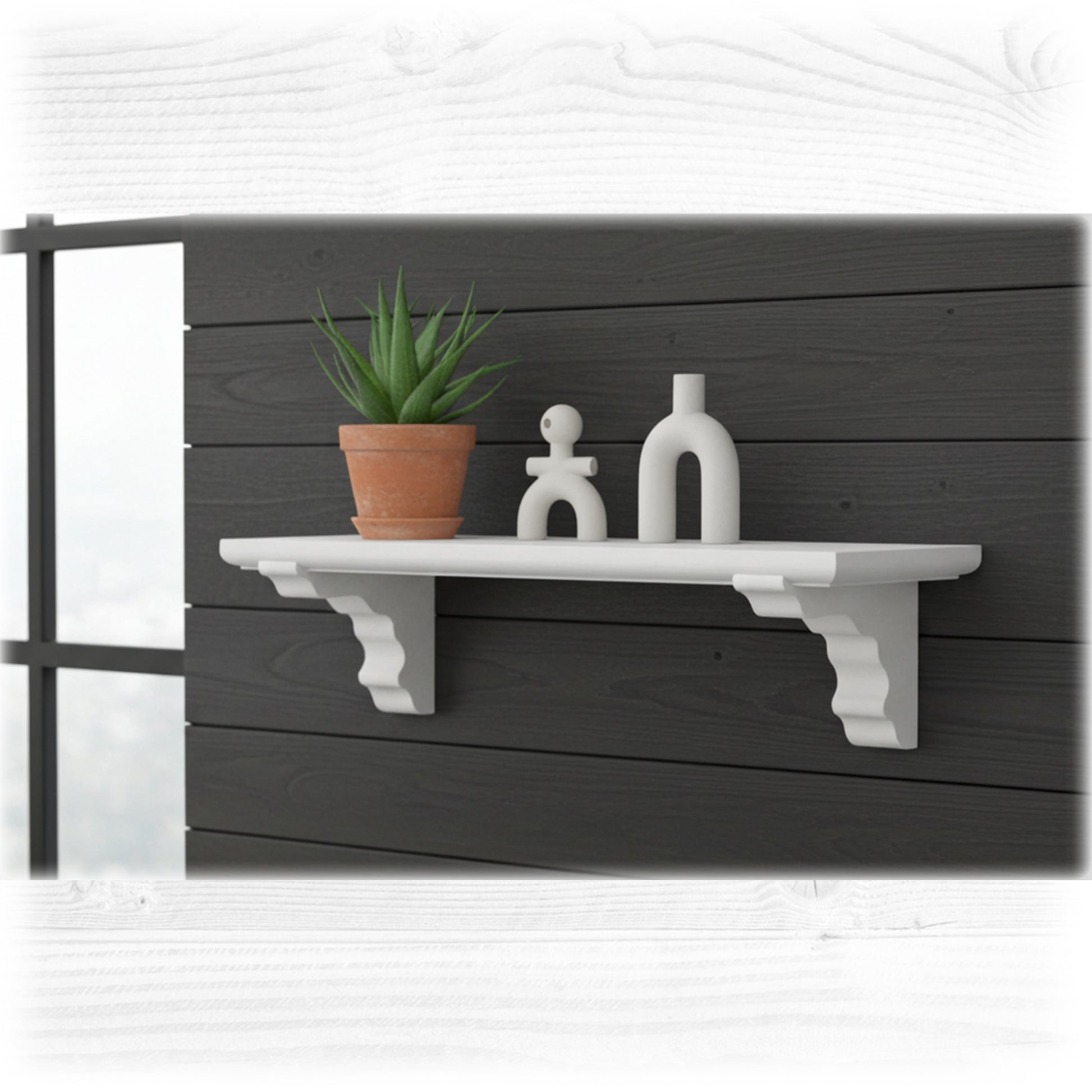White shelf with a plant and decorative items against a dark wooden wall.