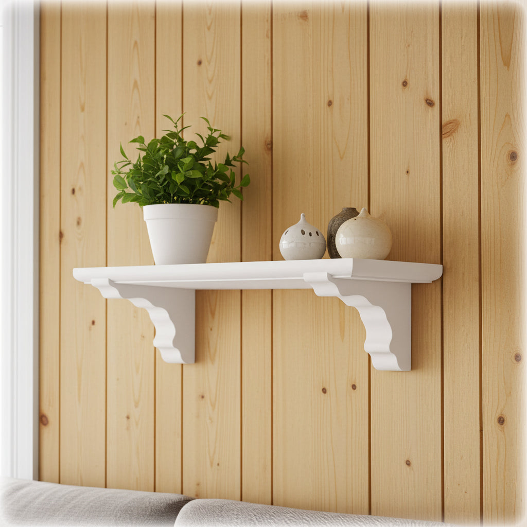 White shelf with a plant and decorative items against a wooden wall.