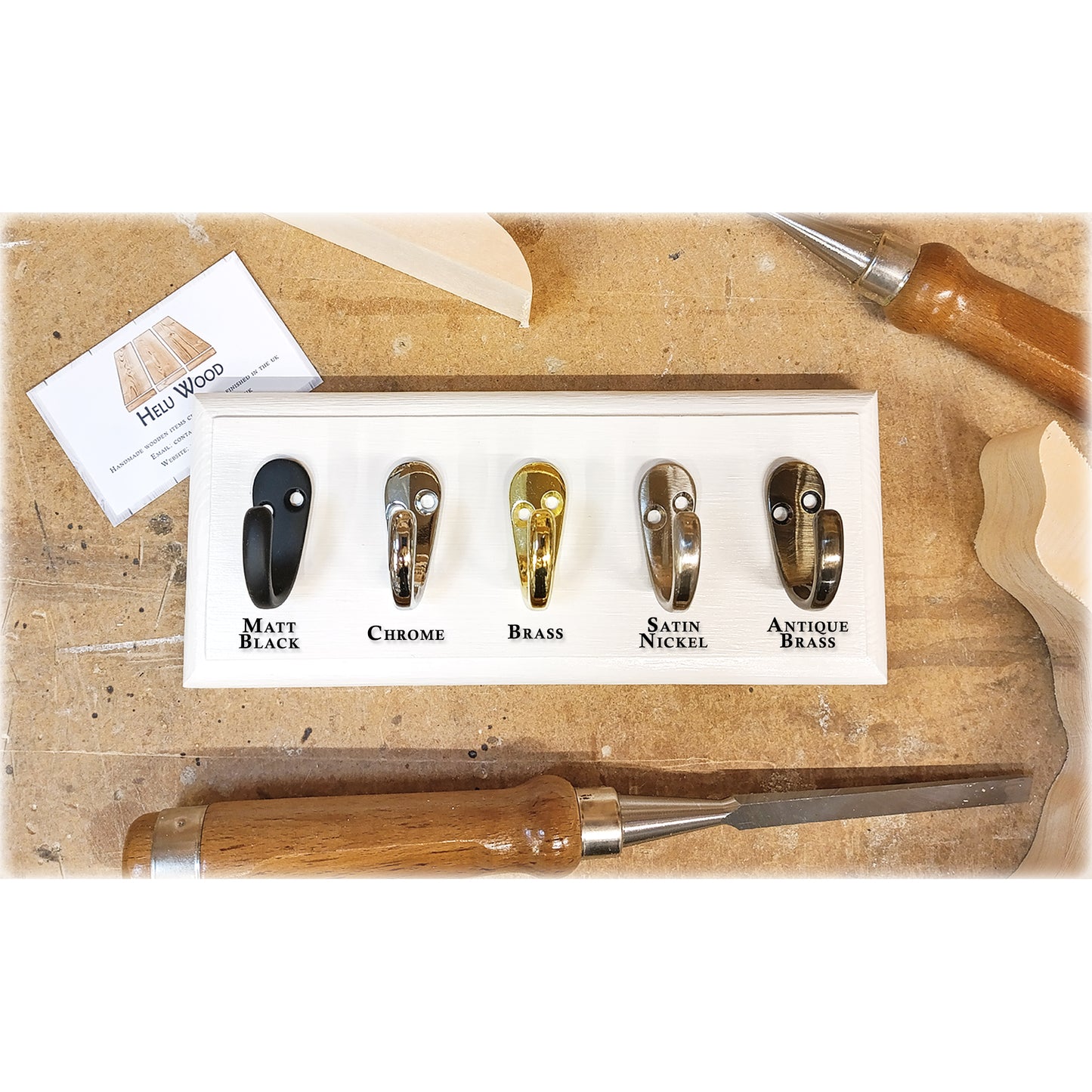 Set of single hooks with colour options on a wooden background with tools